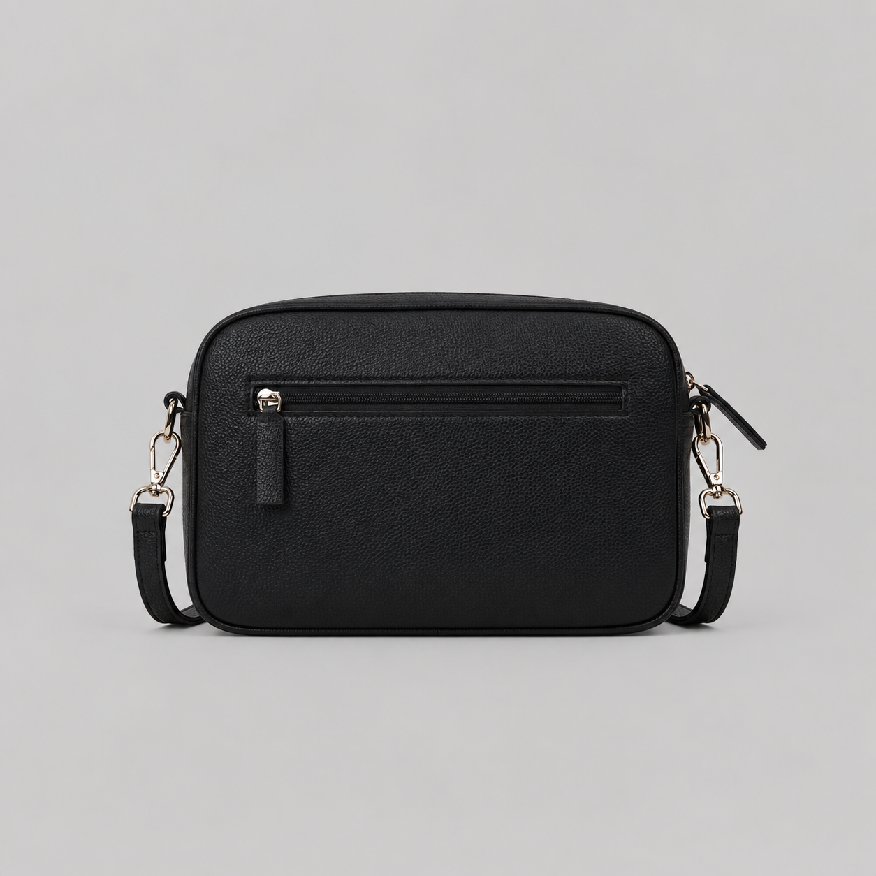 The Daily in Black literary bag displaying back zip pocket