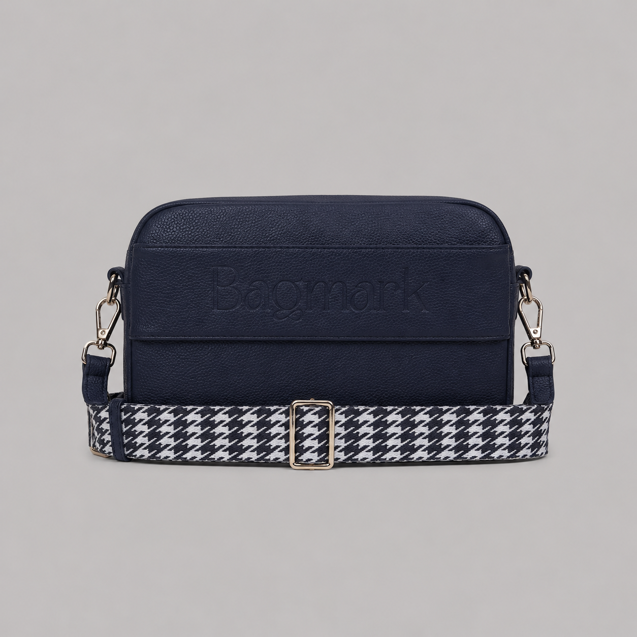 The Daily in Navy  bookmark crossbody bag with a patterned webbing strap