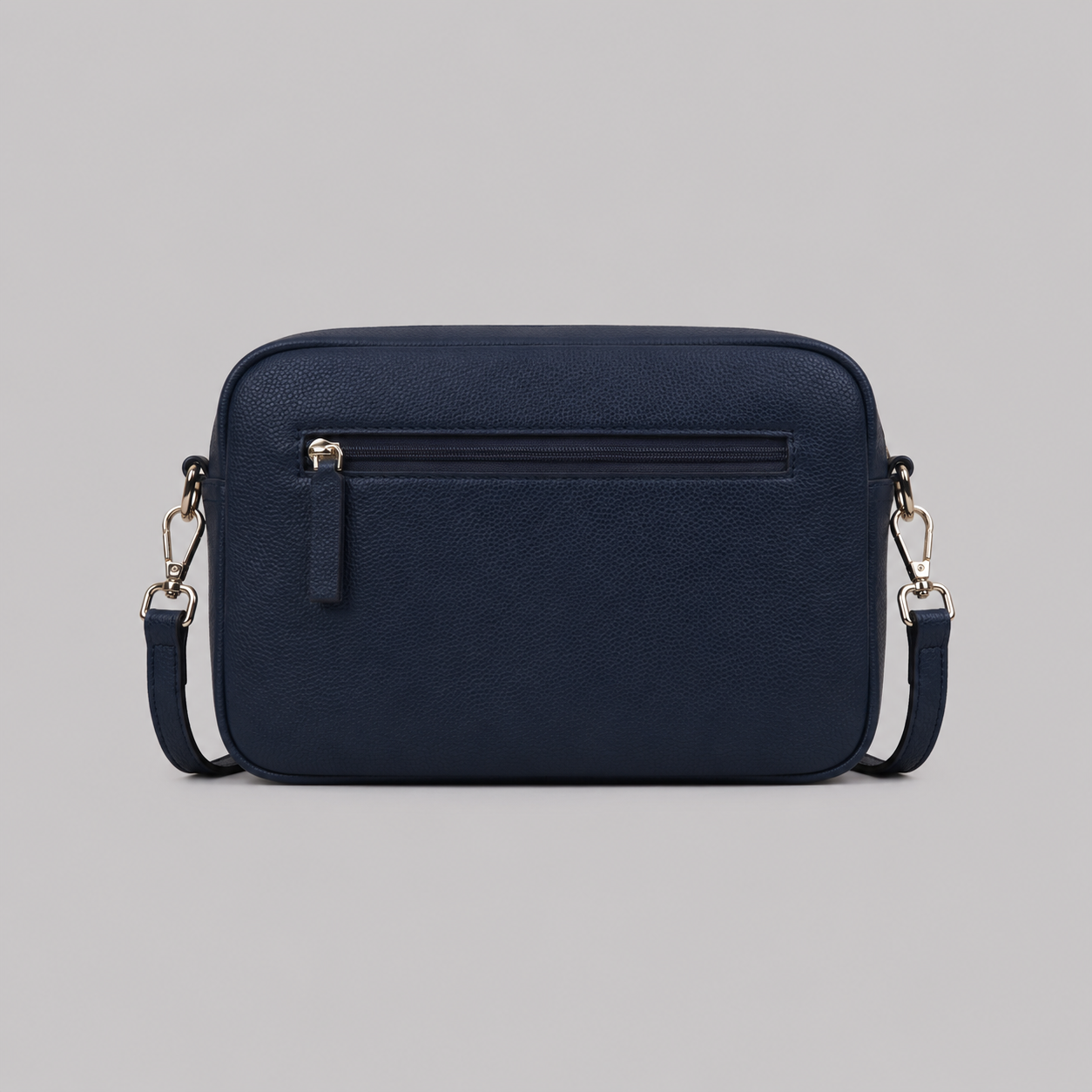 The Daily in Navy literary bag displaying back zip pocket