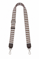 Houndstooth patterned strap with metal hooks on a white background